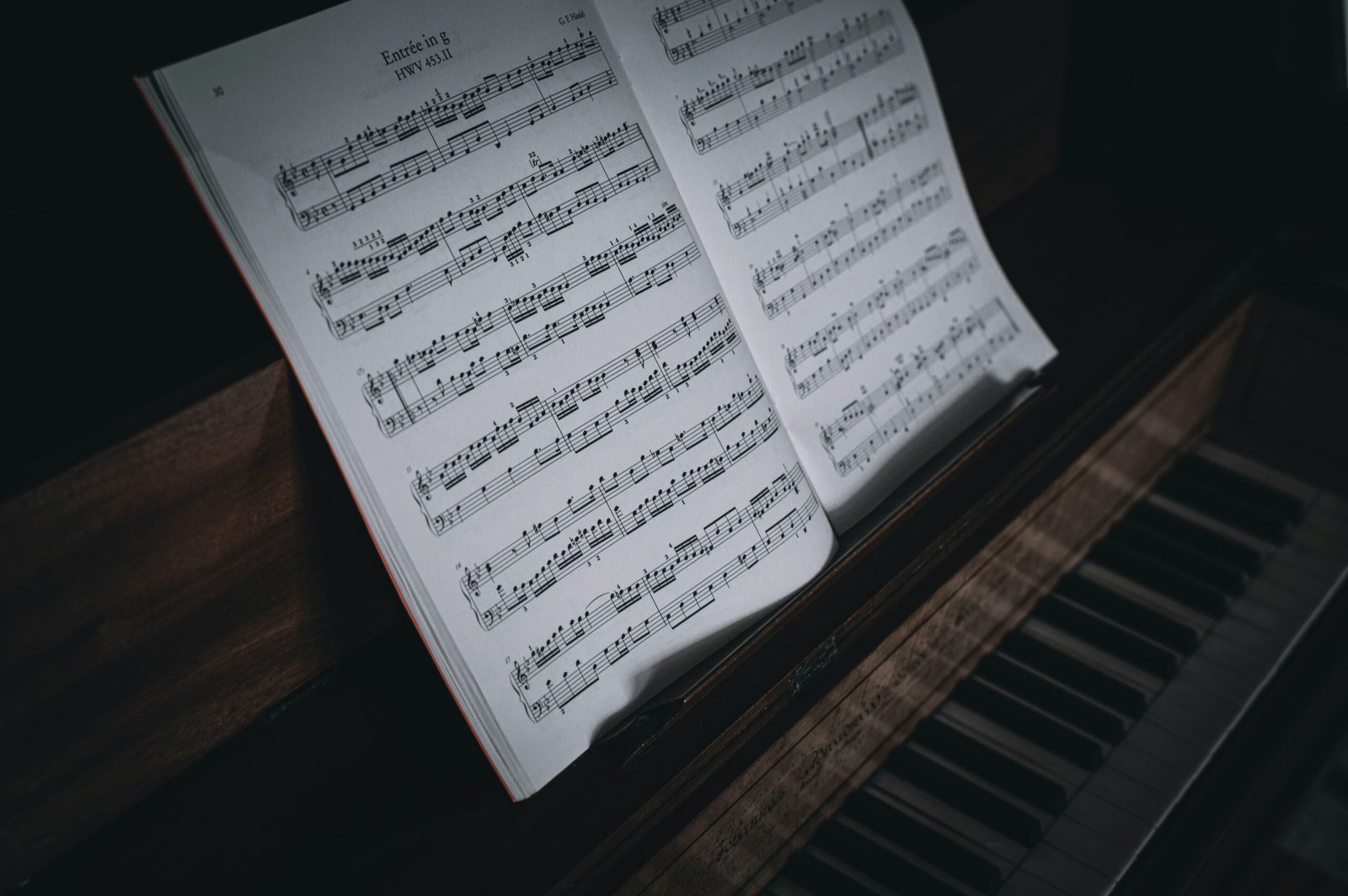 sheet music sitting on top of a piano